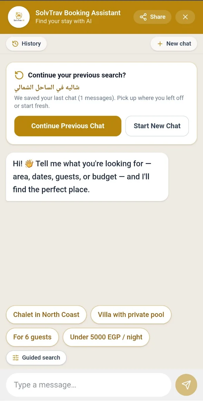 The SolvTrav booking assistant: a chat thread offering to resume a previous search for a North Coast chalet, with suggestion chips for party size, area and price ceiling, and a guided-search fallback beneath them.